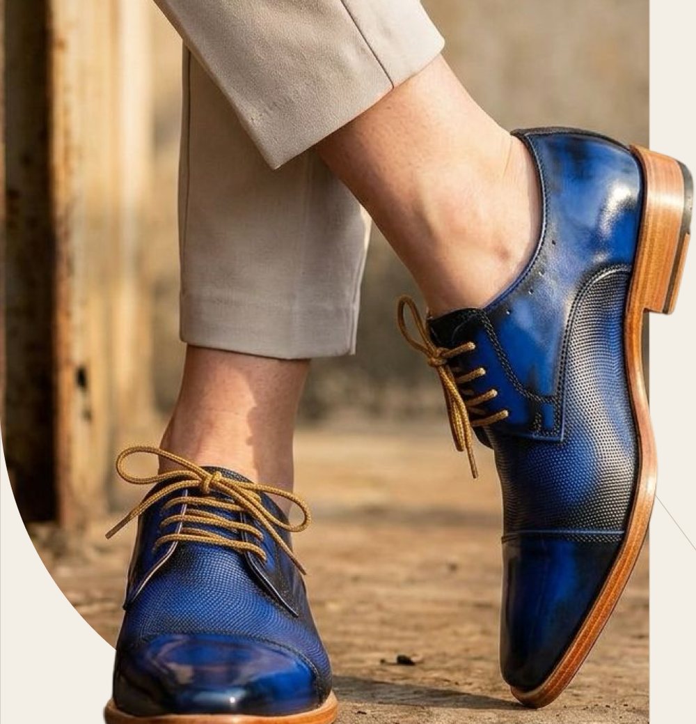 Blue patina cap-toe derby, worn mid-step